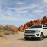 parked white Ford Explorer SUV